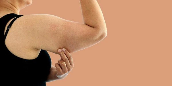 Toning Bingo Wings: Your Ultimate Guide to Sculpting Sleek Arms at the Gym 1 Woman doing push-ups for arm strength Chelmsford