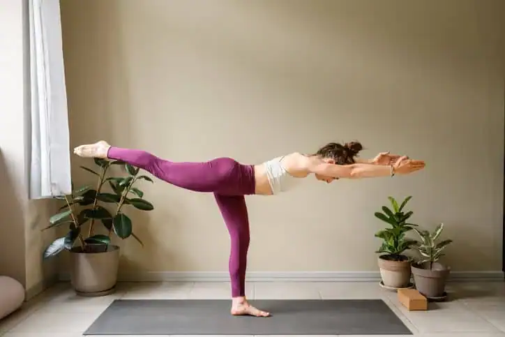 Achieving the Perfect Tone: How Often Should You Exercise for Results? 1 Woman doing Yoga exercise Chelmsford to help with toning the body.